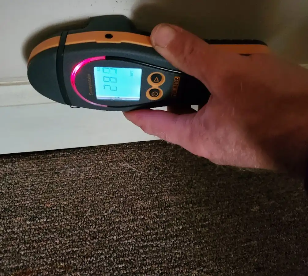 Moisture detection at baseboard during Storm Damage Restoration in Calumet City